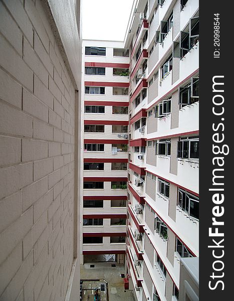 Photo depicting windows and walls of low cost housing program in Singapore. Photo depicting windows and walls of low cost housing program in Singapore