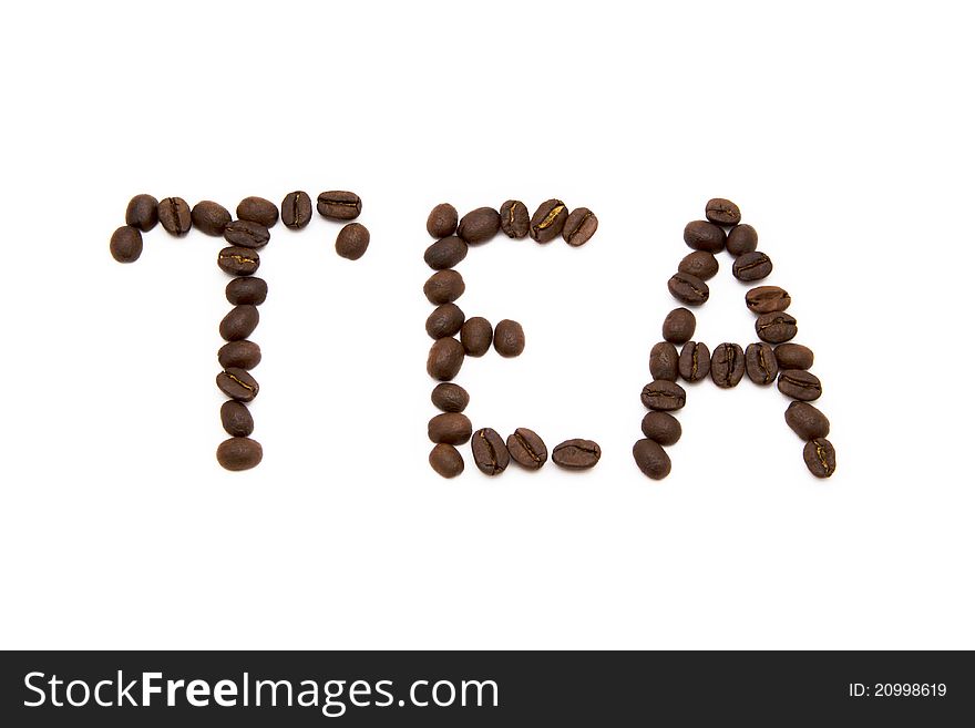 Word tea spelled with fried coffee beans