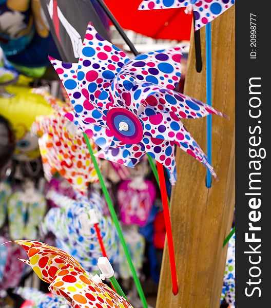 Colourful rotating pinwheel. Souvenir market