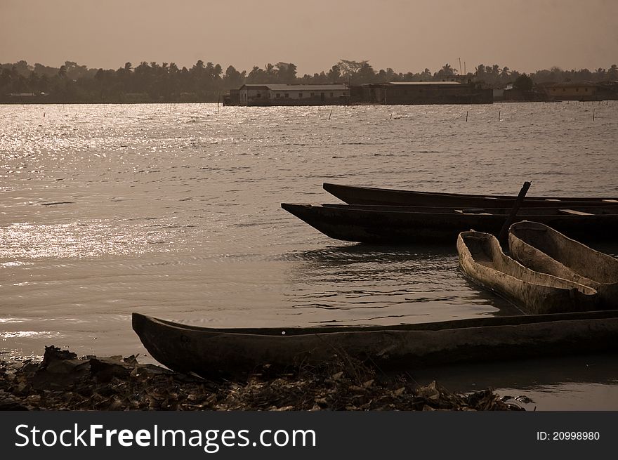 Empty wooden canoes in the Saint-Louis bay, Senegal, at the mouth of the Senegal river. Empty wooden canoes in the Saint-Louis bay, Senegal, at the mouth of the Senegal river