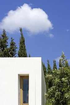 New, White Building With Trees And Blue Sky Royalty Free Stock Photography