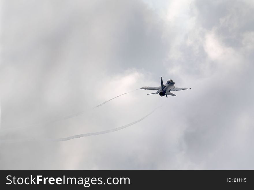 F-16 Jet with vapor trails