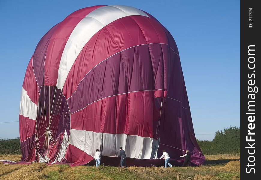 Packing up balloon after landing. Packing up balloon after landing