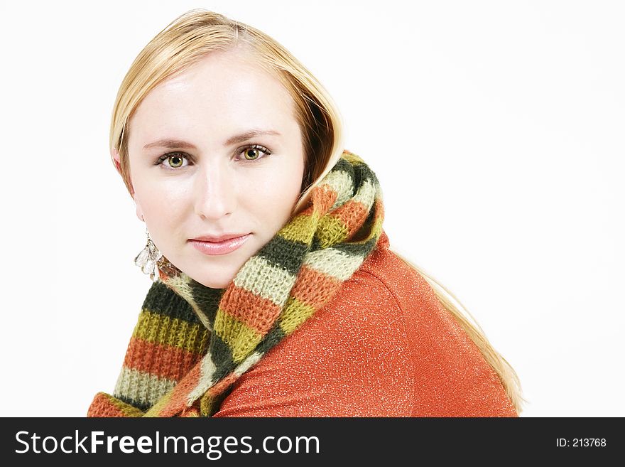 Young blond girl with bright striped winter scarf. Young blond girl with bright striped winter scarf