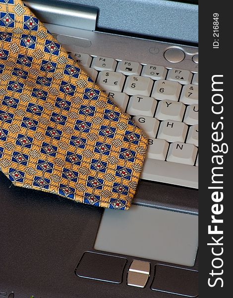 A scarf on a laptop keyboard. A scarf on a laptop keyboard