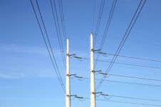 Two White Electricity Pylons And Stretching Wires Royalty Free Stock Photography Two White Electricity Pylons And Stretching Wires Royalty Free Stock Photography