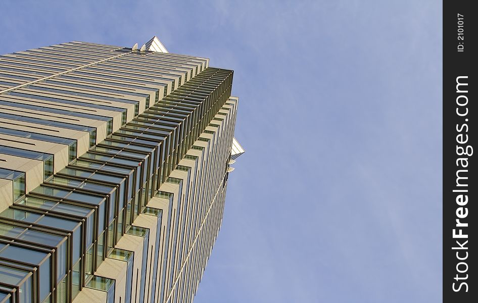 Down-up perspective near a modern skyscraper. Down-up perspective near a modern skyscraper.