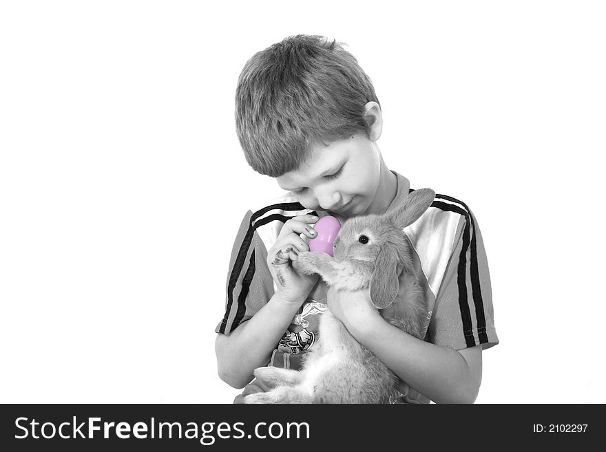 Adorable little boy holding a Easter bunny. Adorable little boy holding a Easter bunny.