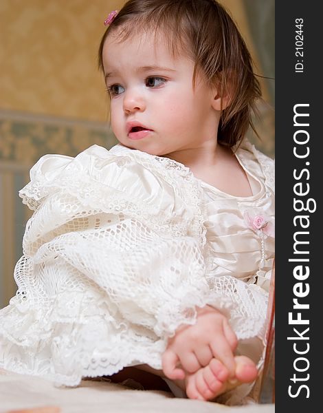 Portrait of cute little girl dressed in the formal wear.