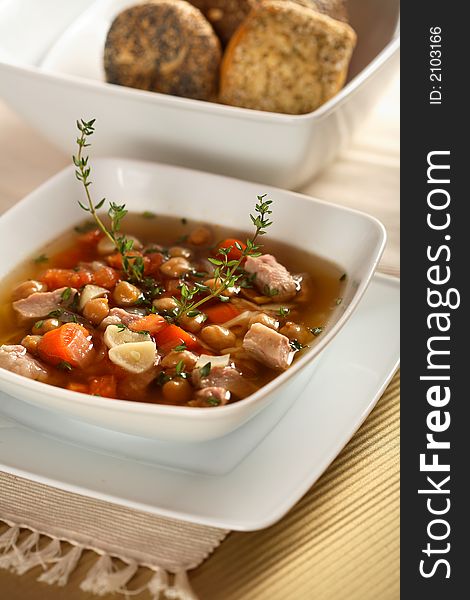 Meat with vegetables and herbs in the bowl