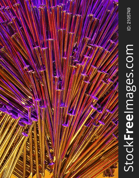 Arrangement of nails, with light from three flash-units each of them with a filter of different colour. Arrangement of nails, with light from three flash-units each of them with a filter of different colour