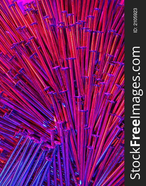 Arrangement of nails, with light from three sides,each of them in an other colour. Arrangement of nails, with light from three sides,each of them in an other colour.