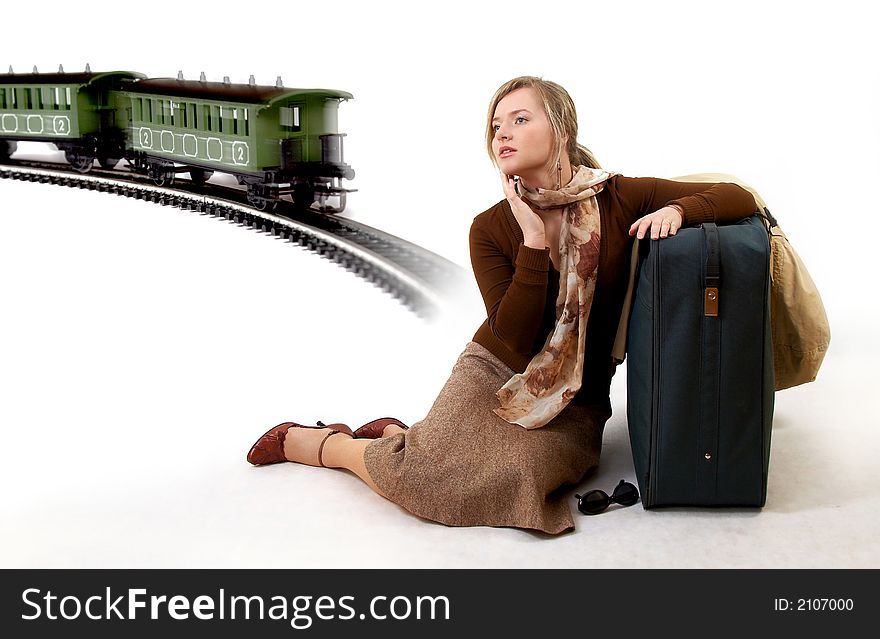 Woman with huge bag is waiting for train