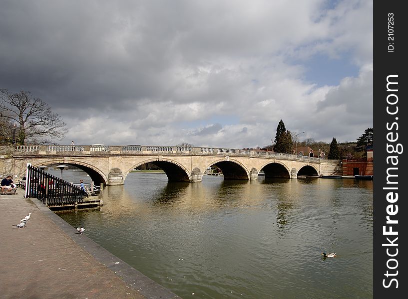 Storm Clouds over an Historic Road Bridge over the River Thames in England. Storm Clouds over an Historic Road Bridge over the River Thames in England
