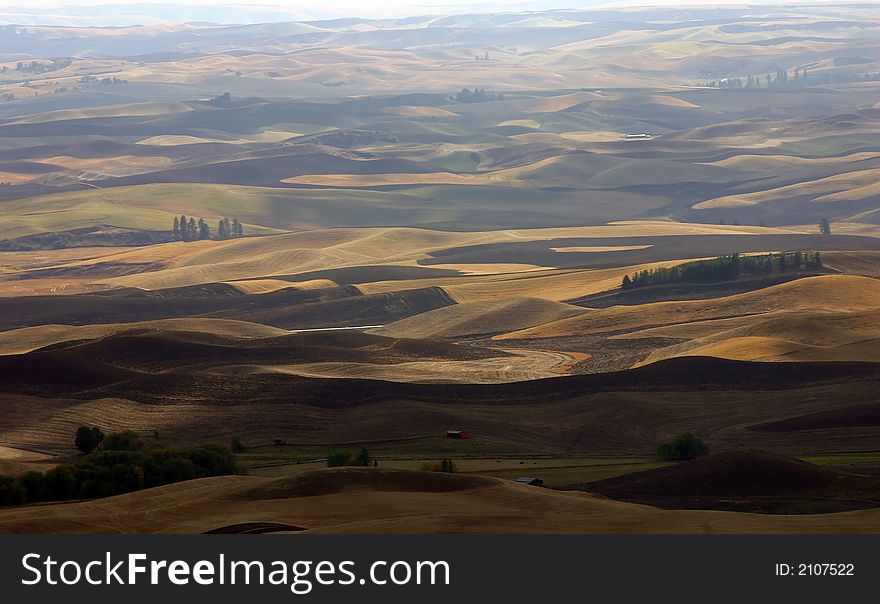 Farmlands and farmhouses in Autumn near Palouse, Eastern Washington. Farmlands and farmhouses in Autumn near Palouse, Eastern Washington