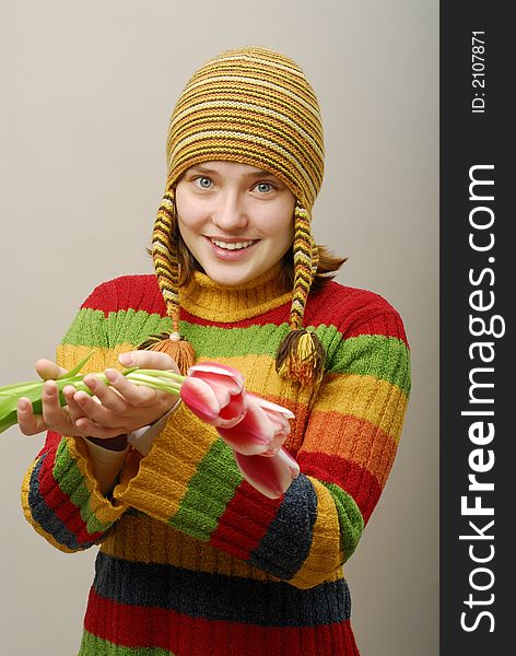 Girl with blue clear eyes holds tulips. Girl with blue clear eyes holds tulips