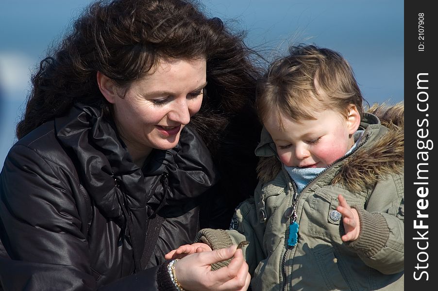 Mother And Cute Boy On The Beach