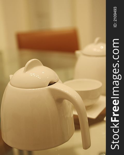 Eletant white teapot and cups made of china porcelain