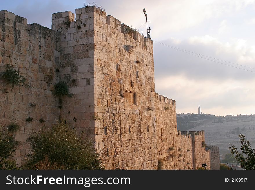 A fragment of the Old City Walls of Jerusalem at dawn. A fragment of the Old City Walls of Jerusalem at dawn.