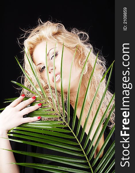 Young sexual woman in black background. Shot in studio. Young sexual woman in black background. Shot in studio.