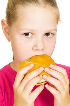 Little Girl Eating Hamburger. Royalty Free Stock Photo Little Girl Eating Hamburger. Royalty Free Stock Photo
