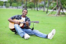 Man Playing Guitar In The Park Royalty Free Stock Image Man Playing Guitar In The Park Royalty Free Stock Image