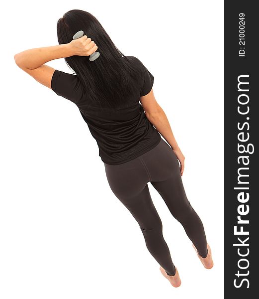 A young female dressed in gym clothes performing dumbell fly exercise on isolated white background. A young female dressed in gym clothes performing dumbell fly exercise on isolated white background