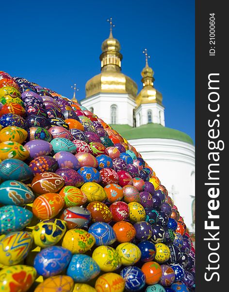 The Pechersk Lavra sits behind colourful sphere of eggs. The Pechersk Lavra sits behind colourful sphere of eggs