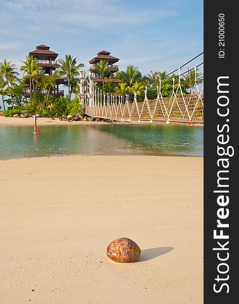 Wooden bridge linking to tropical paradise island.