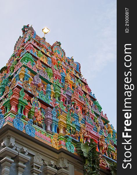 Generic Hindu temple with colorful and elaborate designs on the roof.