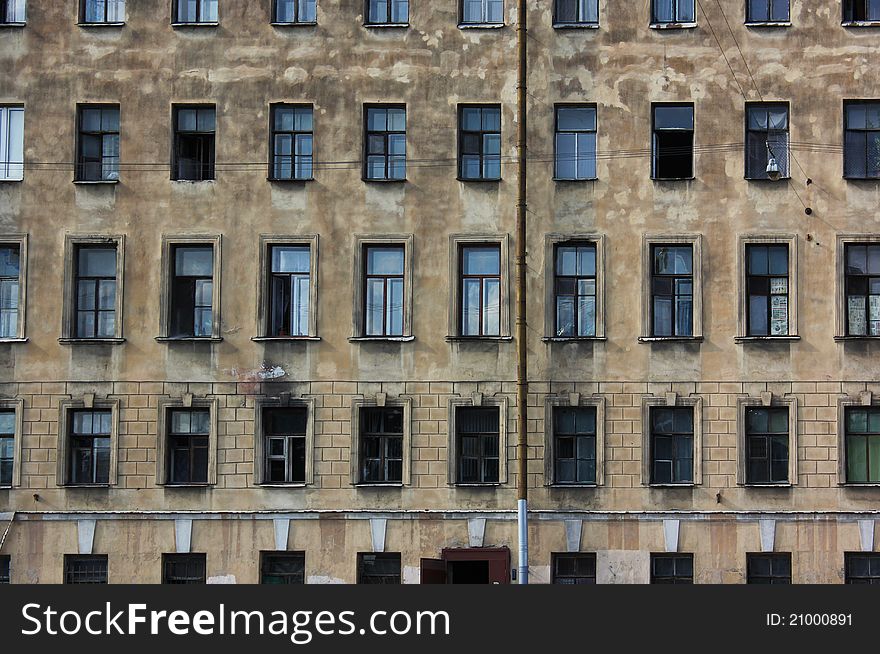 Windows of old block of flats in St. Petersburg