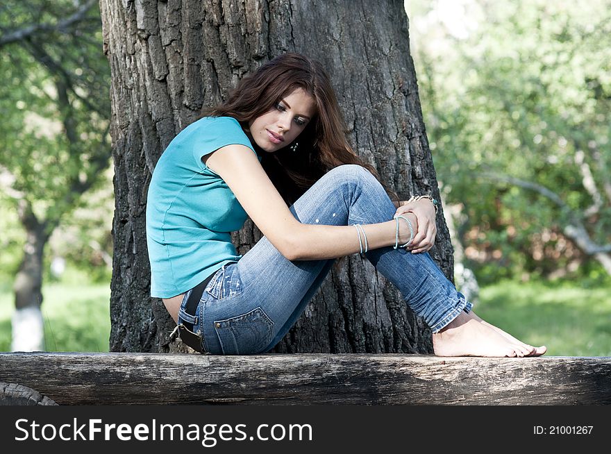 Beautiful Girl Sitting On A Bench