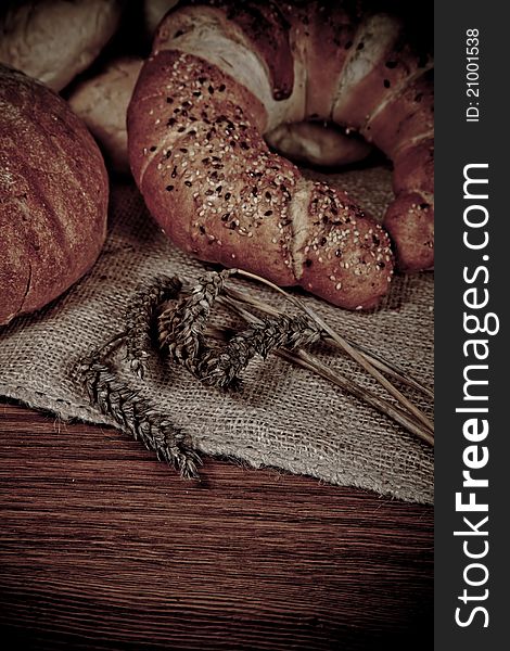 Composition of fresh bread on wood