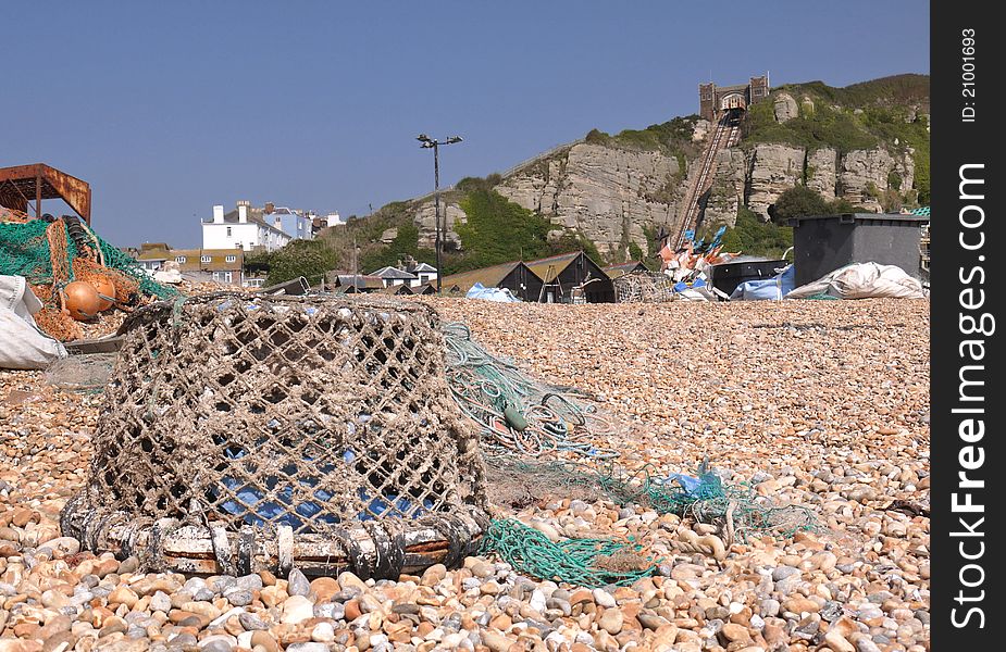 An old crab pot sitting on a pebbled beach. An old crab pot sitting on a pebbled beach