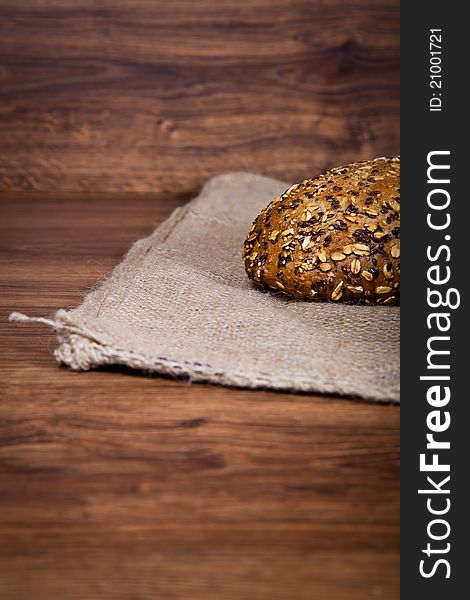 Composition of fresh bread on wooden background