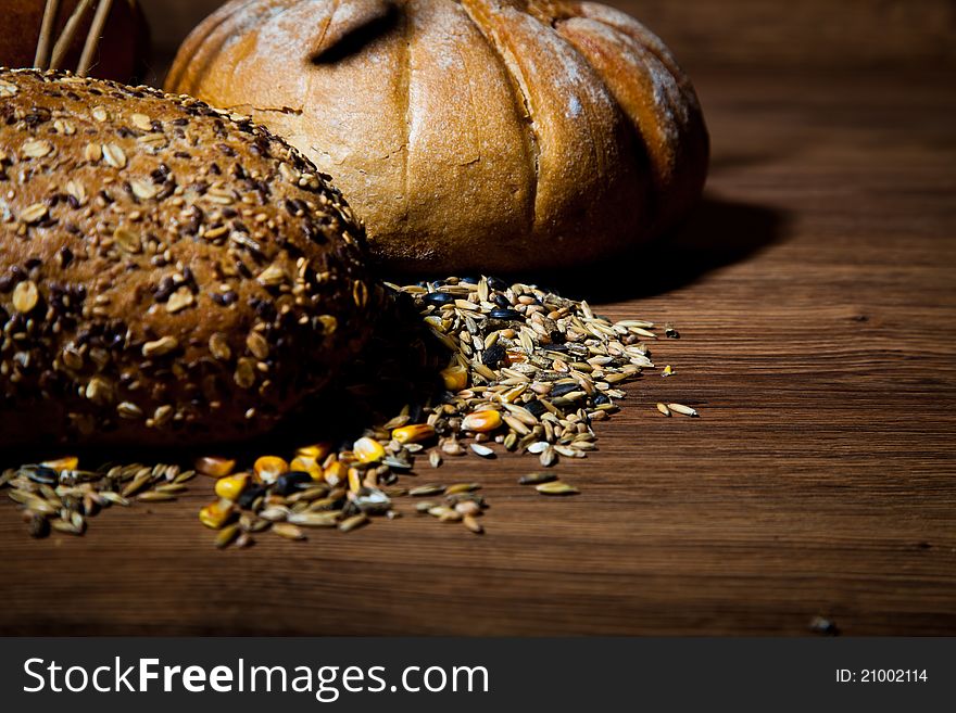 Composition of fresh bread on wooden background