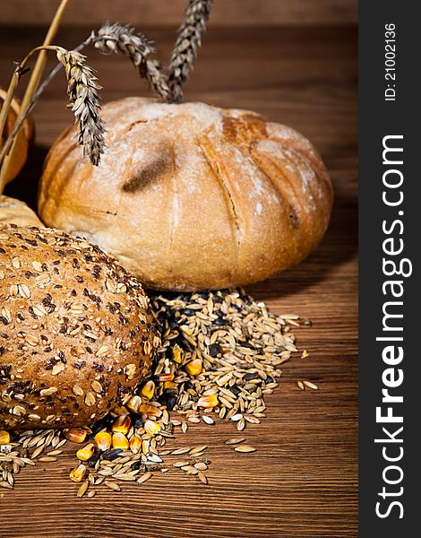 Composition of fresh bread on wooden background