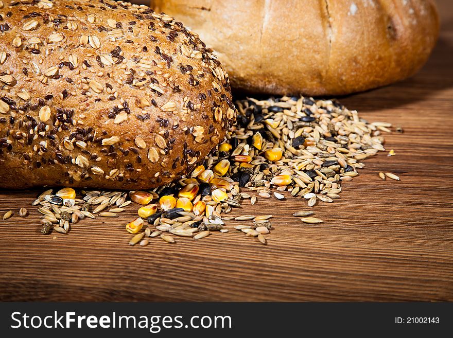 Composition of fresh bread on wooden background