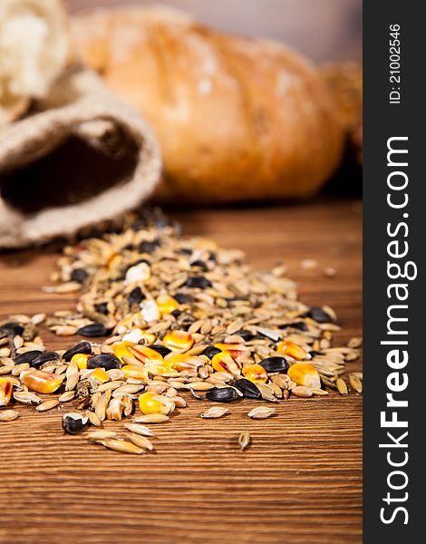 Composition of fresh bread on wooden background