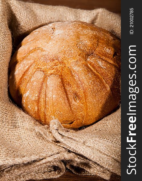 Composition of fresh bread on wooden background