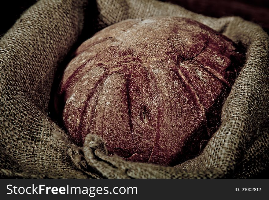 Composition of fresh bread on wooden background