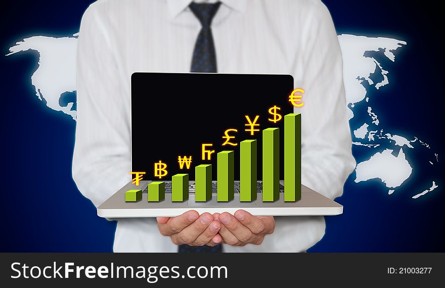 Businessman holding laptop with currency graph