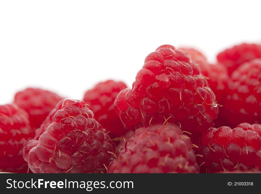 Red raspberries on a white background