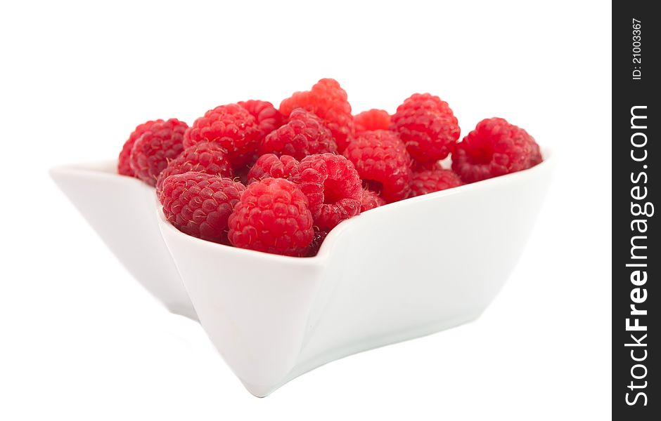 Red raspberries on a white background