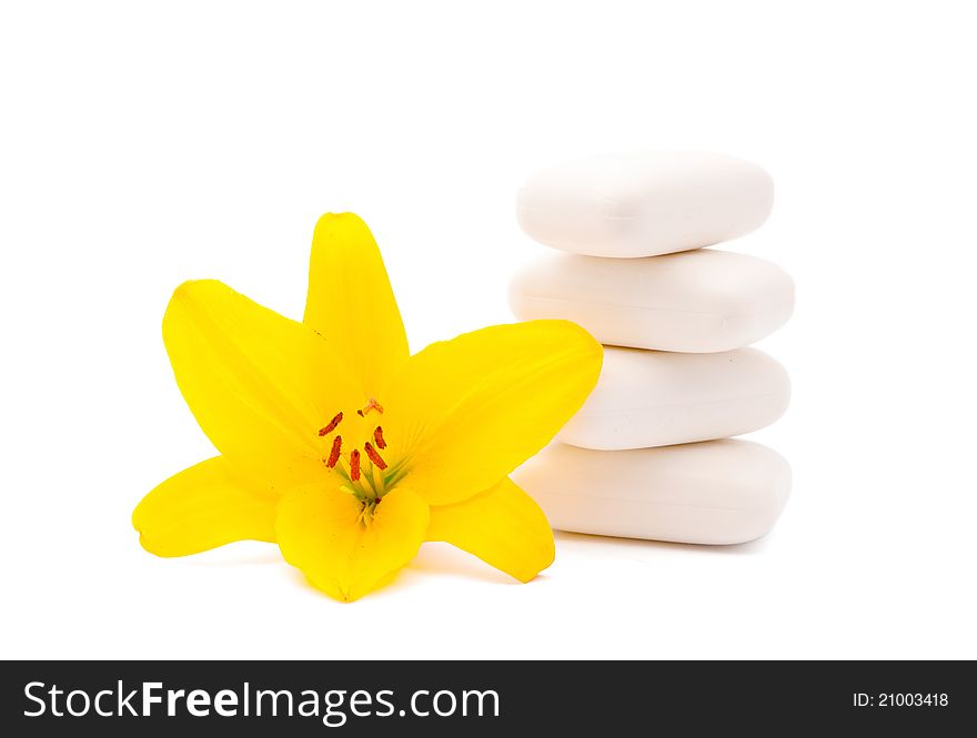 Lily and soap on a white background