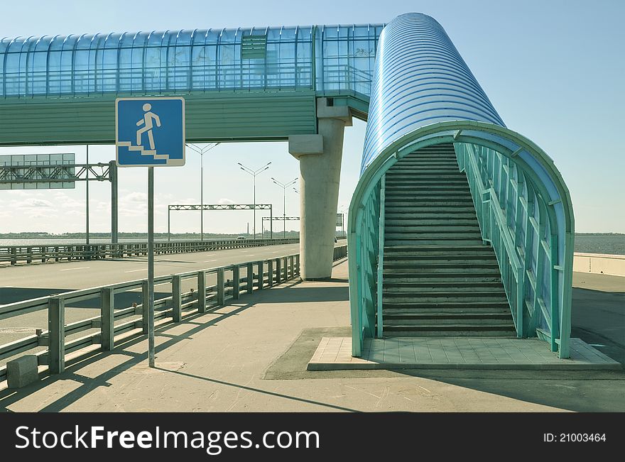 About a dark blue elevated pedestrian crossing