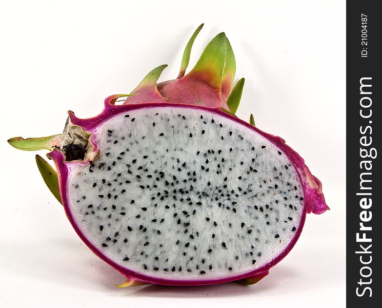 A whole and half dragon fruit.