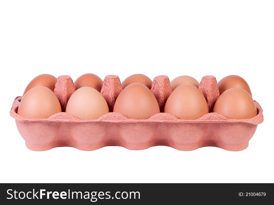 Chicken eggs in carton tray.