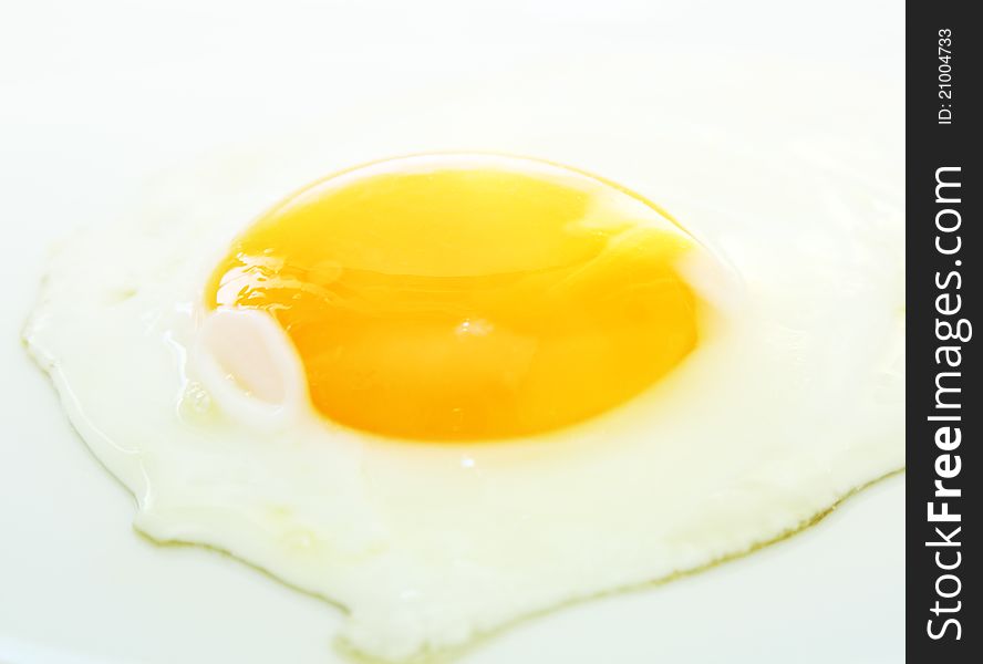 Image of fried egg on white