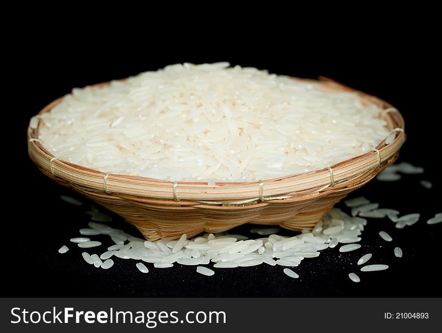 White rice spill out from basket